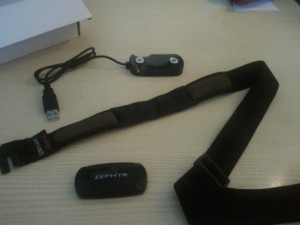 Zephyr HxM Bluetooth heart sensor with its USB cradle and its smart fabric strap.